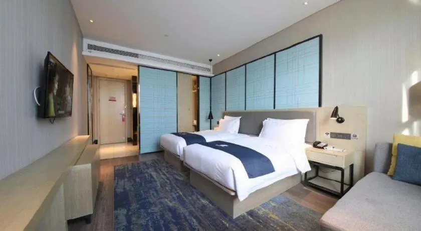 Bed in Echarm Hotel Tai'an Taishan Tianwai Village Hongmen