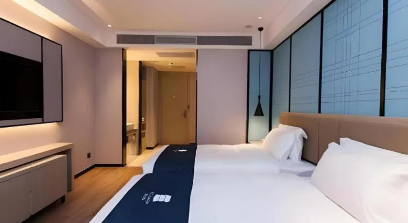 Bed in Echarm Hotel Tai'an Taishan Tianwai Village Hongmen