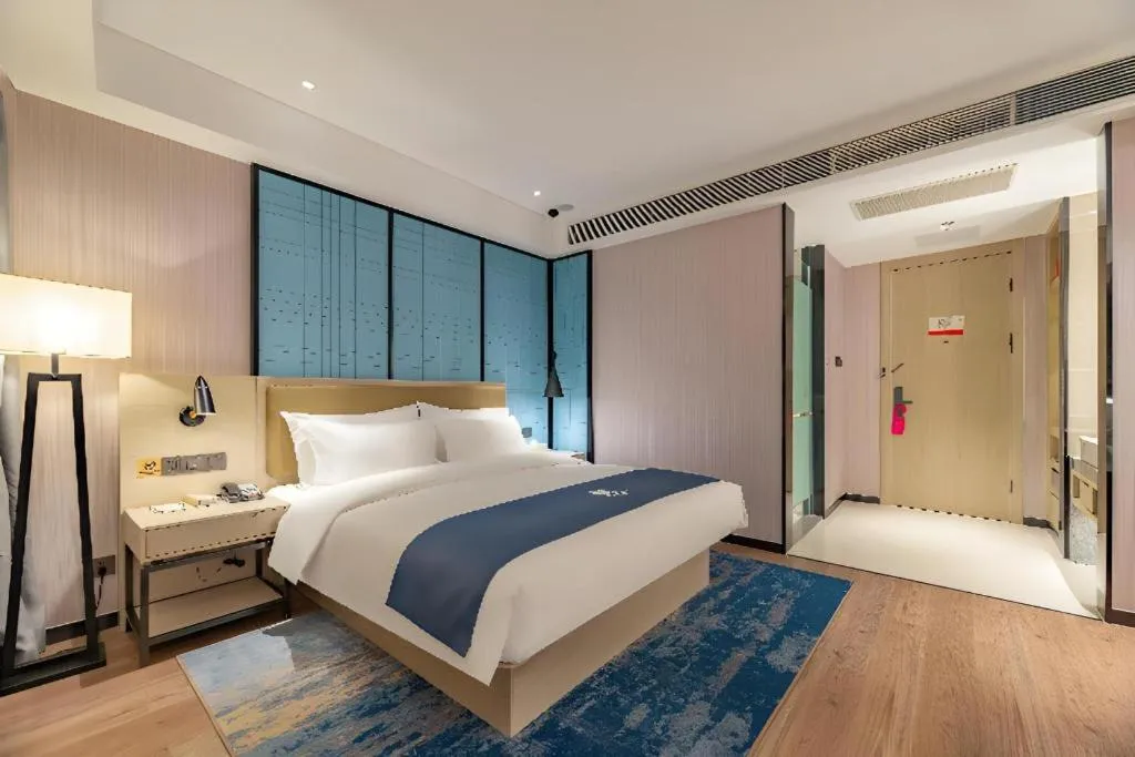 Bed in Echarm Hotel Tai'an Taishan Tianwai Village Hongmen