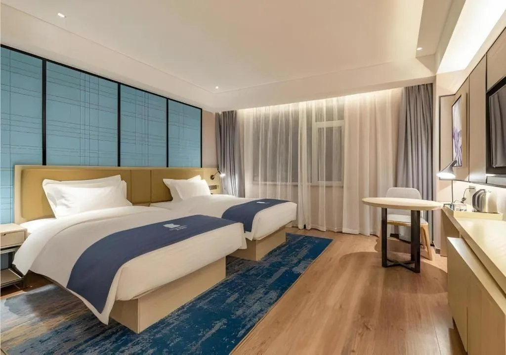 Bed in Echarm Hotel Tai'an Taishan Tianwai Village Hongmen