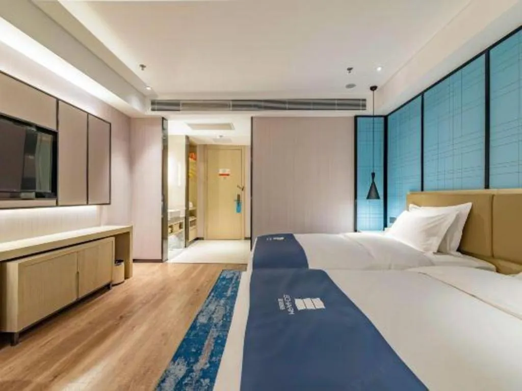 Bed in Echarm Hotel Tai'an Taishan Tianwai Village Hongmen