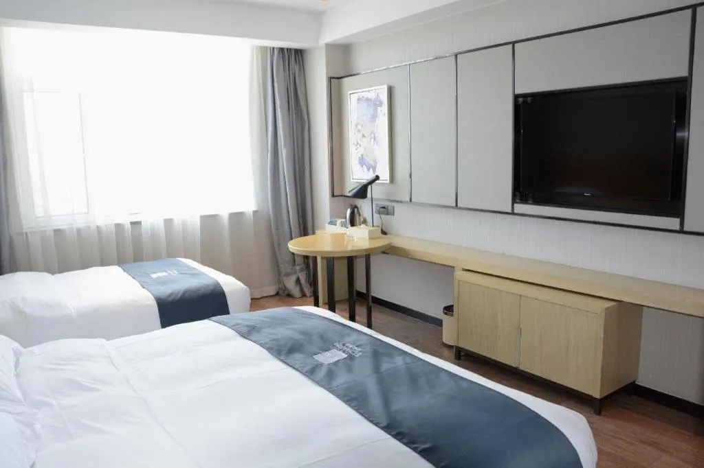 Bed in Echarm Hotel Tai'an Taishan Tianwai Village Hongmen