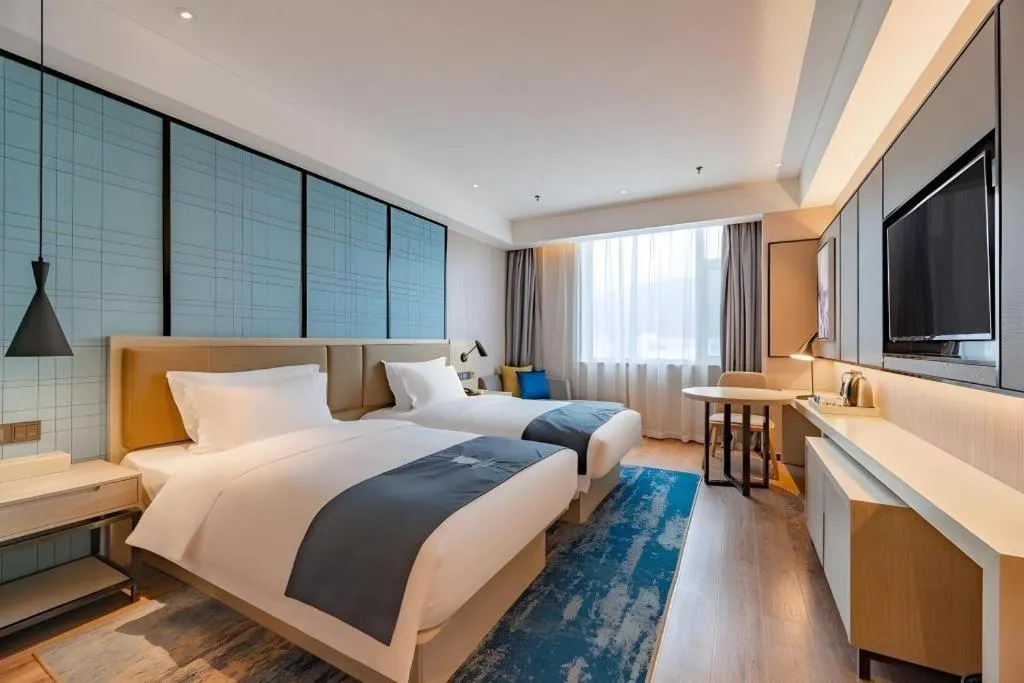 Bed in Echarm Hotel Tai'an Taishan Tianwai Village Hongmen