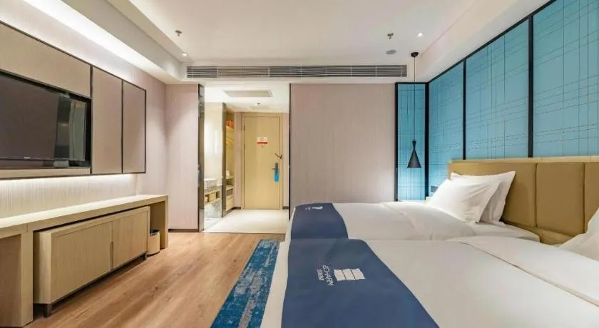 Bed in Echarm Hotel Tai'an Taishan Tianwai Village Hongmen