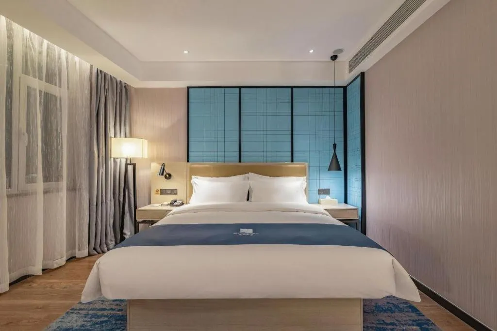 Bed in Echarm Hotel Tai'an Taishan Tianwai Village Hongmen