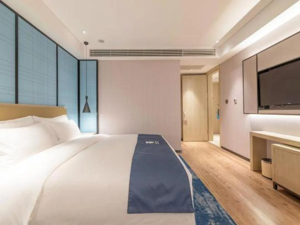 Bed in Echarm Hotel Tai'an Taishan Tianwai Village Hongmen