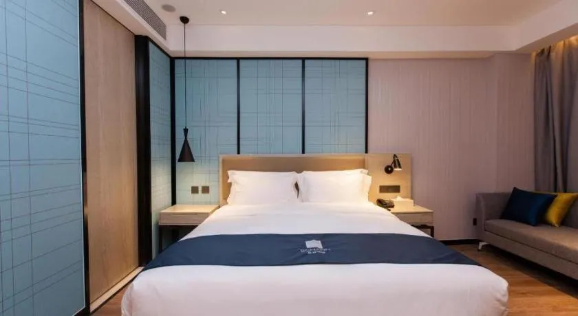 Bed in Echarm Hotel Tai'an Taishan Tianwai Village Hongmen