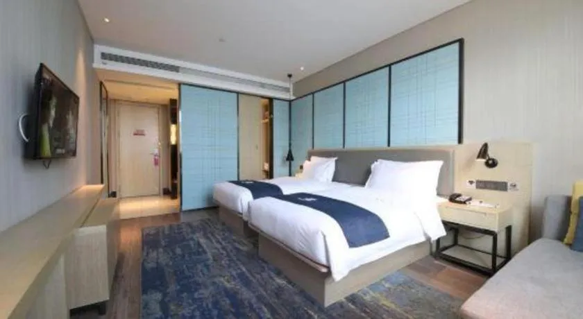 Bed in Echarm Hotel Tai'an Taishan Tianwai Village Hongmen