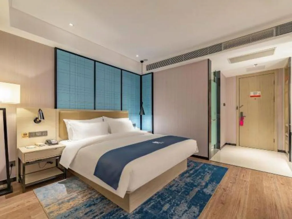 Bed in Echarm Hotel Tai'an Taishan Tianwai Village Hongmen