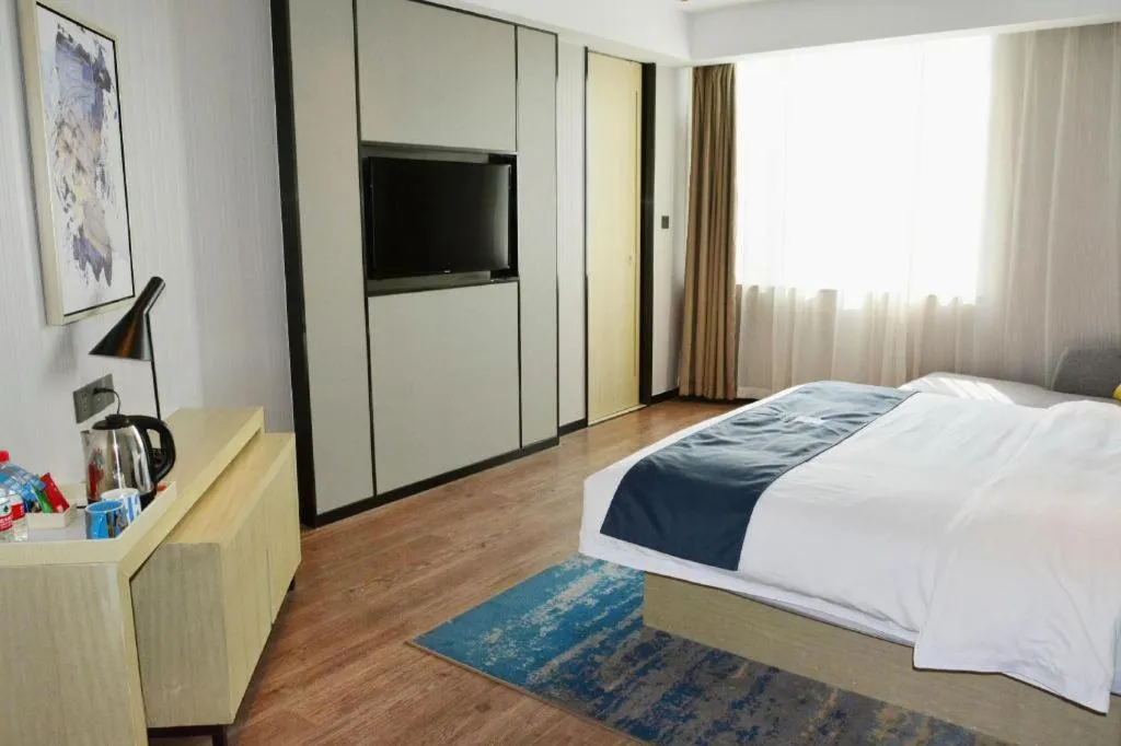 Bed in Echarm Hotel Tai'an Taishan Tianwai Village Hongmen