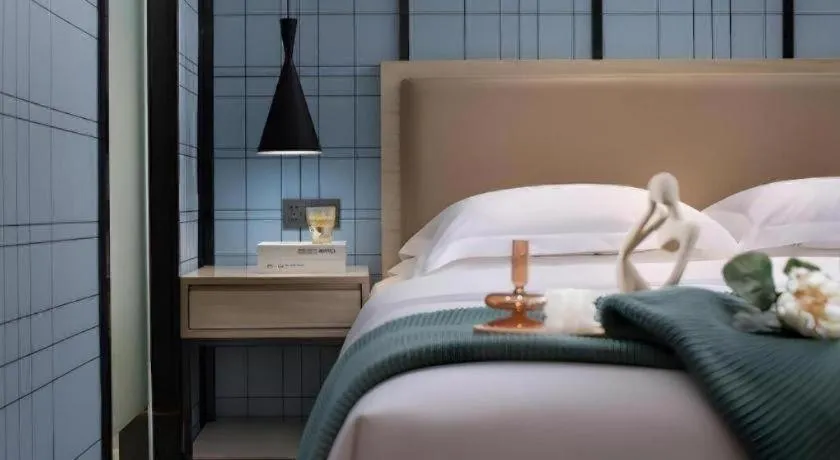 Bed in Echarm Hotel Tai'an Taishan Tianwai Village Hongmen