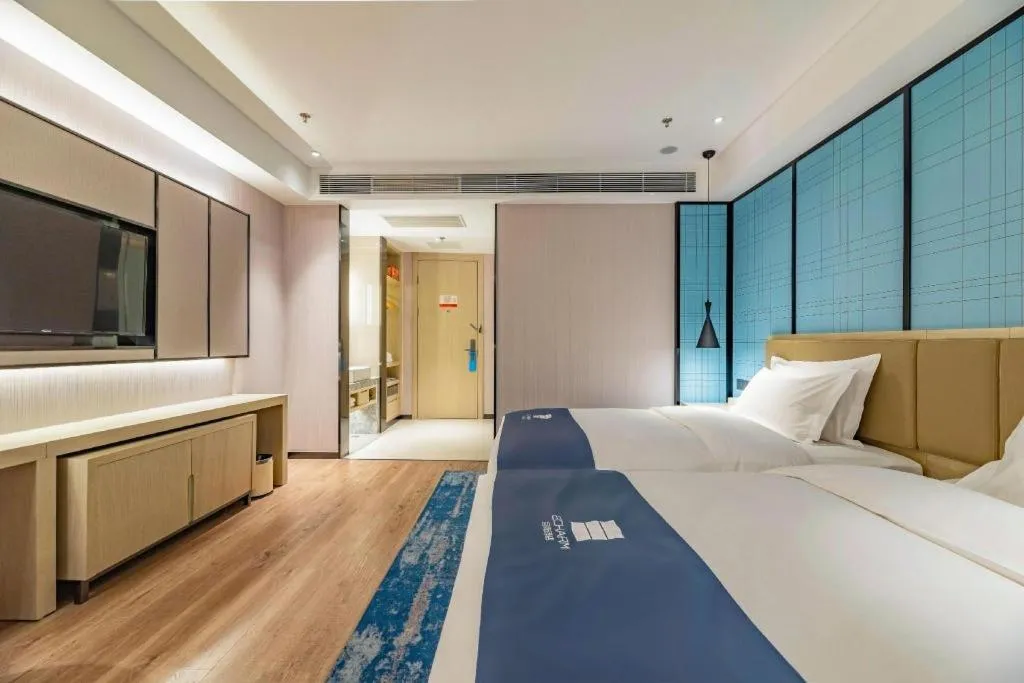 Bed in Echarm Hotel Tai'an Taishan Tianwai Village Hongmen