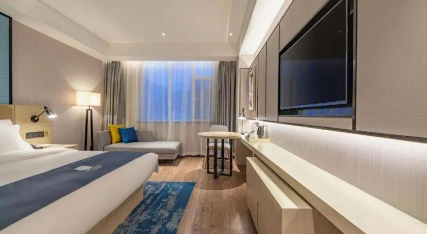 Bed in Echarm Hotel Tai'an Taishan Tianwai Village Hongmen