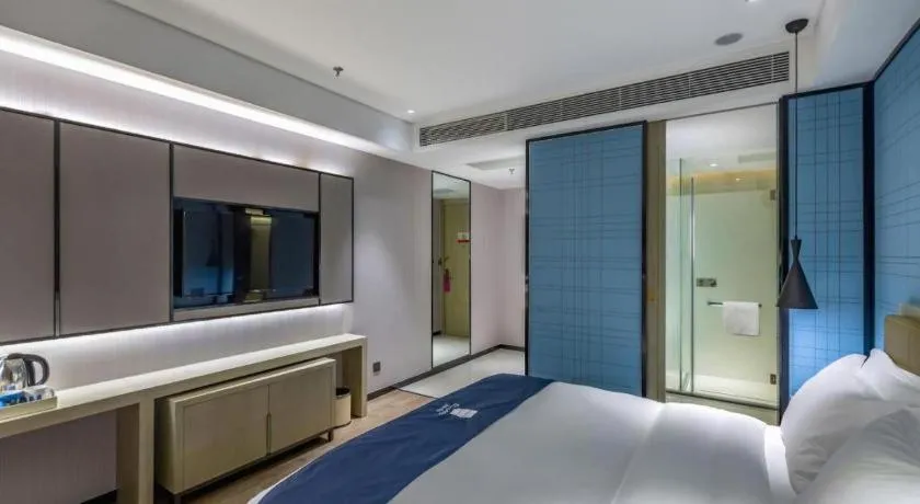 Bed in Echarm Hotel Tai'an Taishan Tianwai Village Hongmen