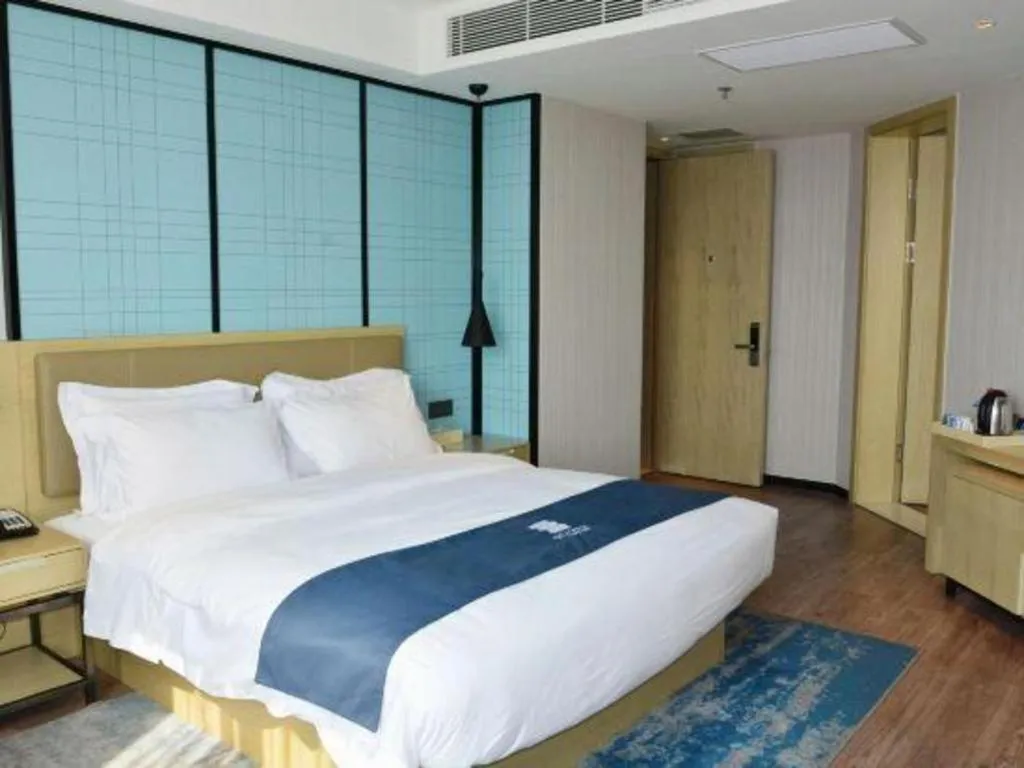 Bed in Echarm Hotel Tai'an Taishan Tianwai Village Hongmen