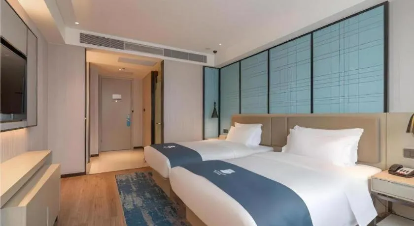 Bed in Echarm Hotel Tai'an Taishan Tianwai Village Hongmen