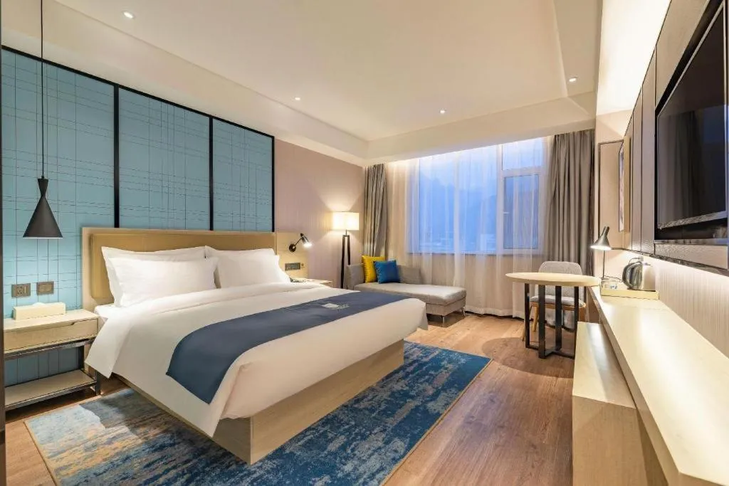 Bed in Echarm Hotel Tai'an Taishan Tianwai Village Hongmen