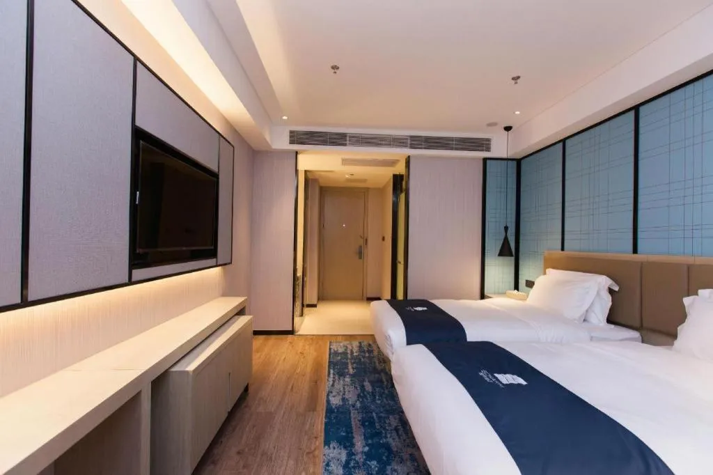 Bed in Echarm Hotel Tai'an Taishan Tianwai Village Hongmen