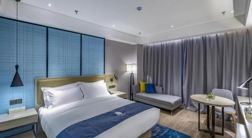 Bed in Echarm Hotel Tai'an Taishan Tianwai Village Hongmen