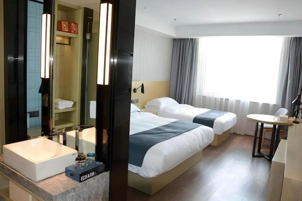 Bed in Echarm Hotel Tai'an Taishan Tianwai Village Hongmen