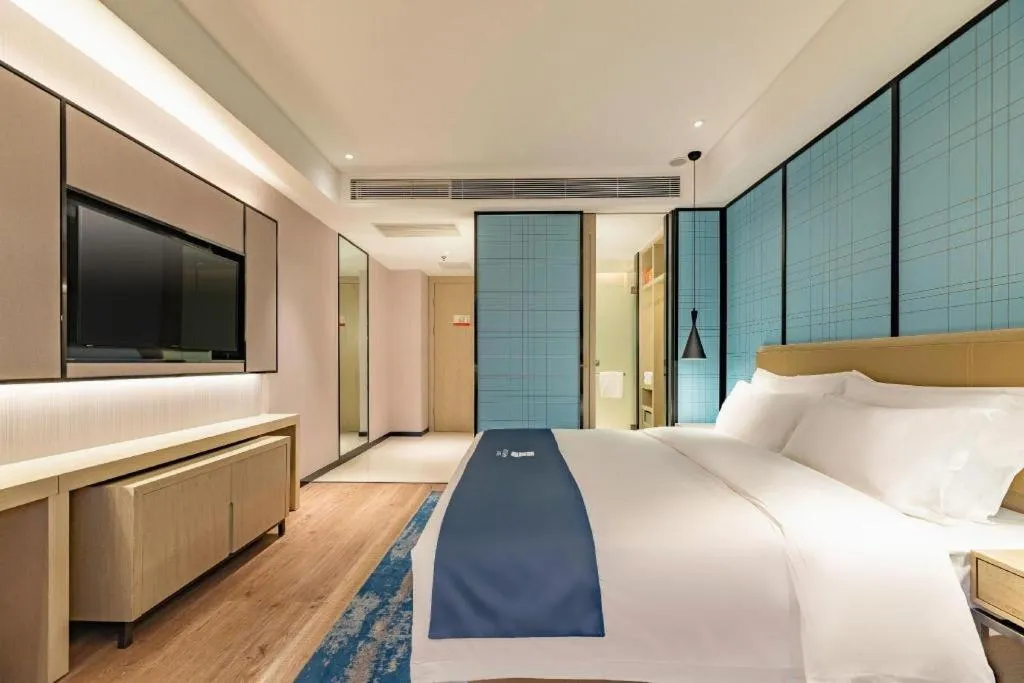 Bed in Echarm Hotel Tai'an Taishan Tianwai Village Hongmen