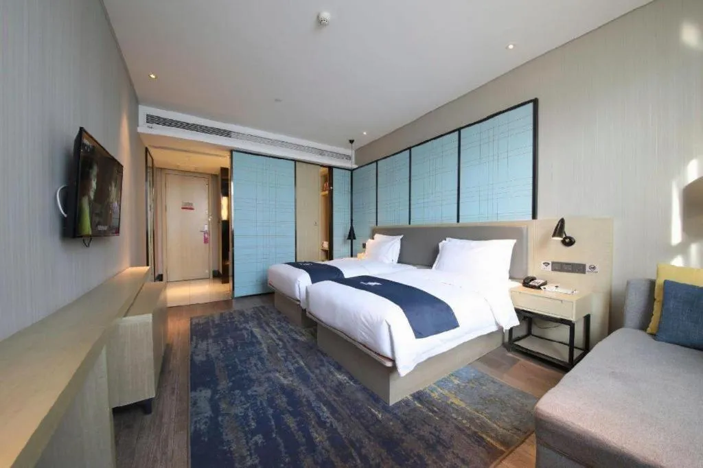 Bed in Echarm Hotel Tai'an Taishan Tianwai Village Hongmen