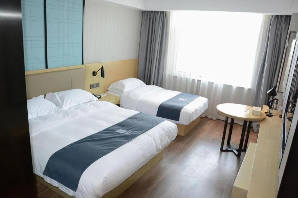 Bed in Echarm Hotel Tai'an Taishan Tianwai Village Hongmen