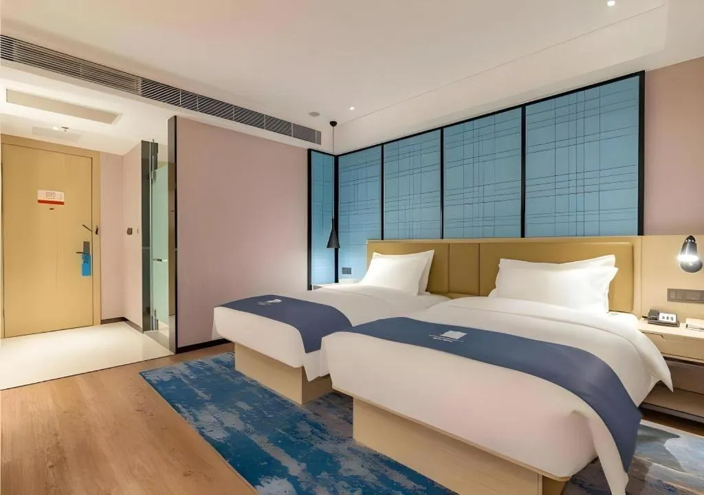 Bed in Echarm Hotel Tai'an Taishan Tianwai Village Hongmen
