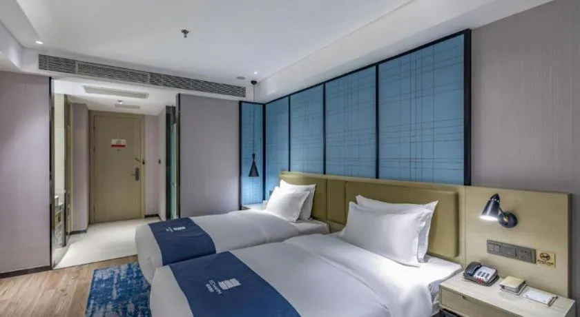 Bed in Echarm Hotel Tai'an Taishan Tianwai Village Hongmen