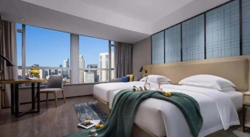 Bed in Echarm Hotel Tai'an Taishan Tianwai Village Hongmen