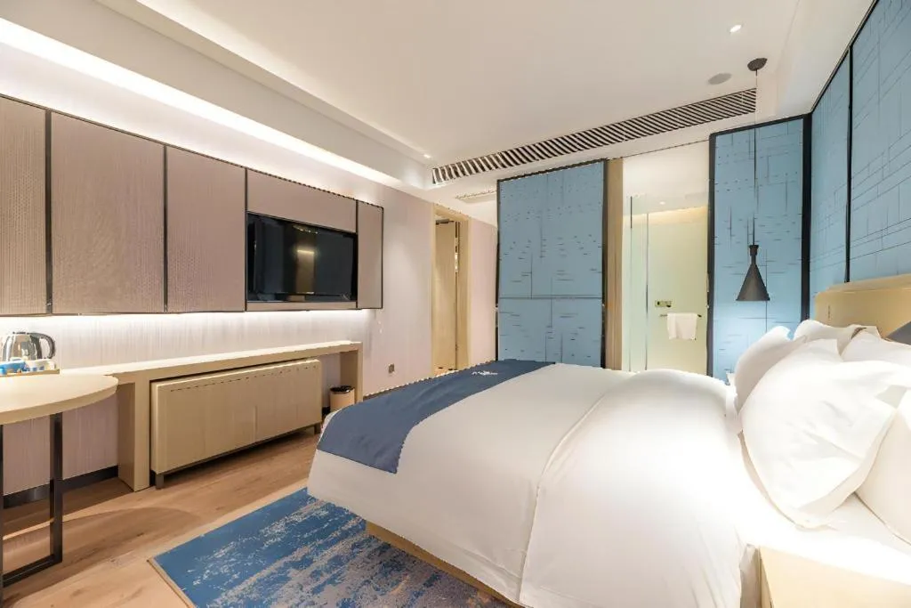 Bed in Echarm Hotel Tai'an Taishan Tianwai Village Hongmen