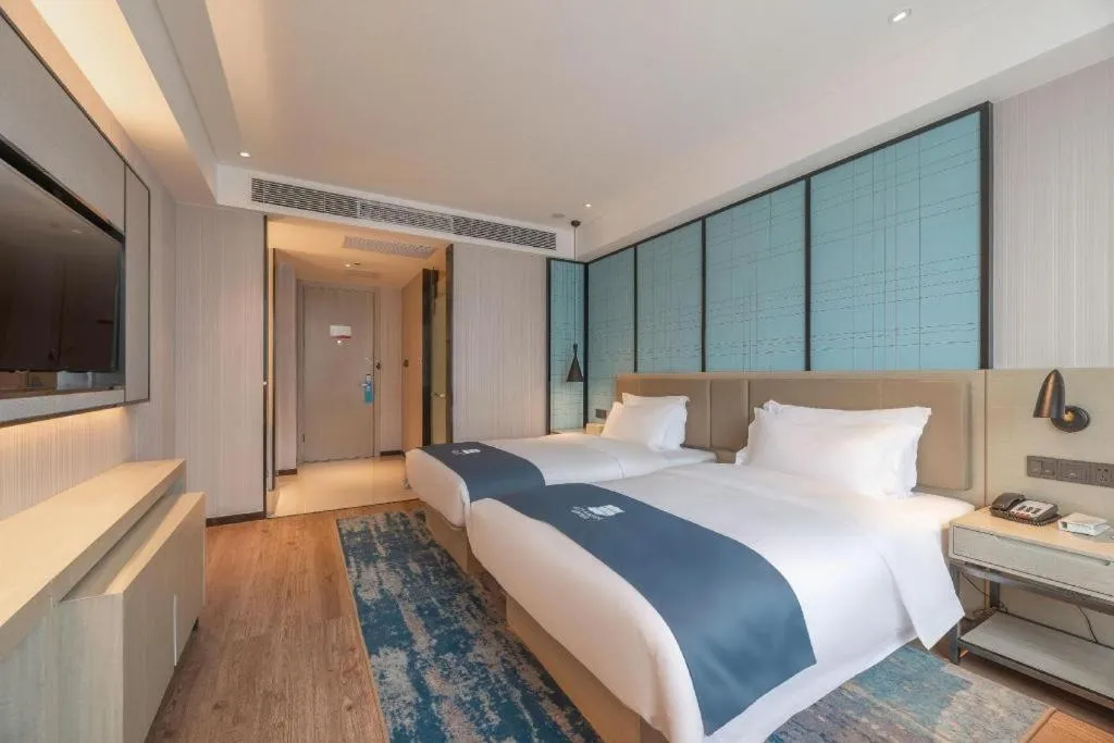 Bed in Echarm Hotel Tai'an Taishan Tianwai Village Hongmen