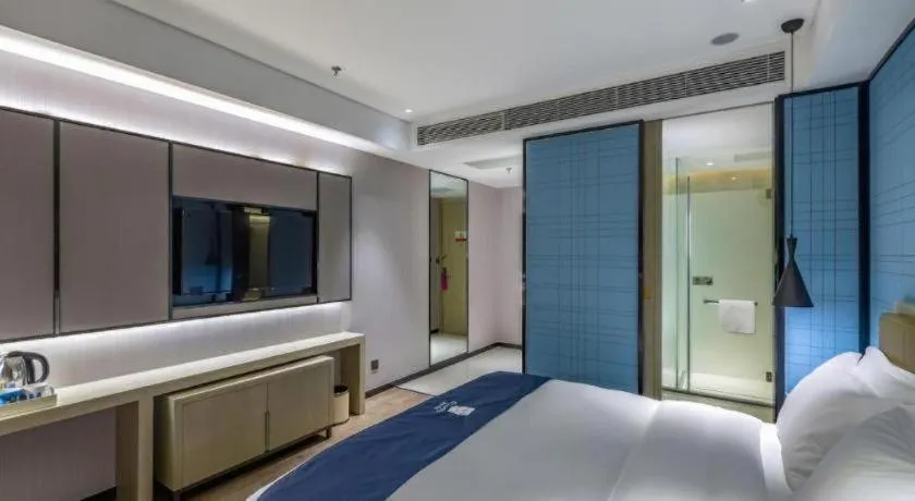 Bed in Echarm Hotel Tai'an Taishan Tianwai Village Hongmen