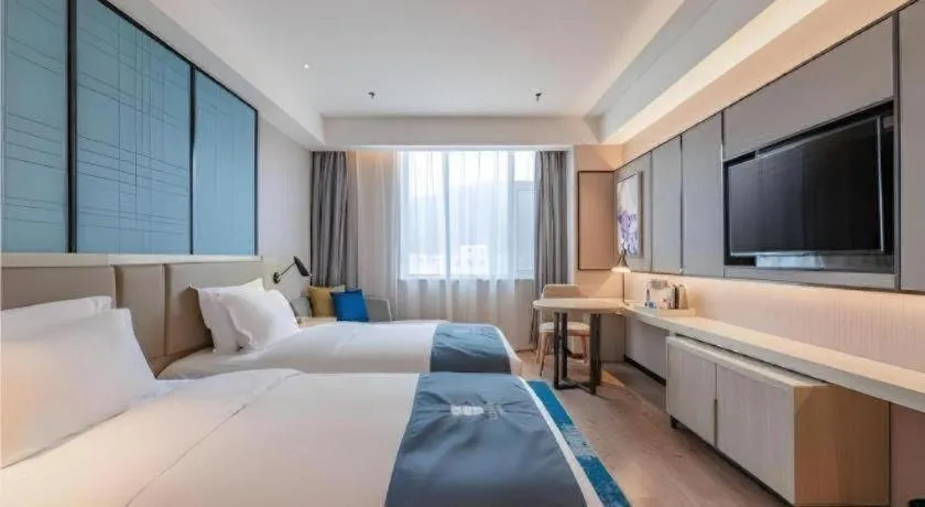 Bed in Echarm Hotel Tai'an Taishan Tianwai Village Hongmen