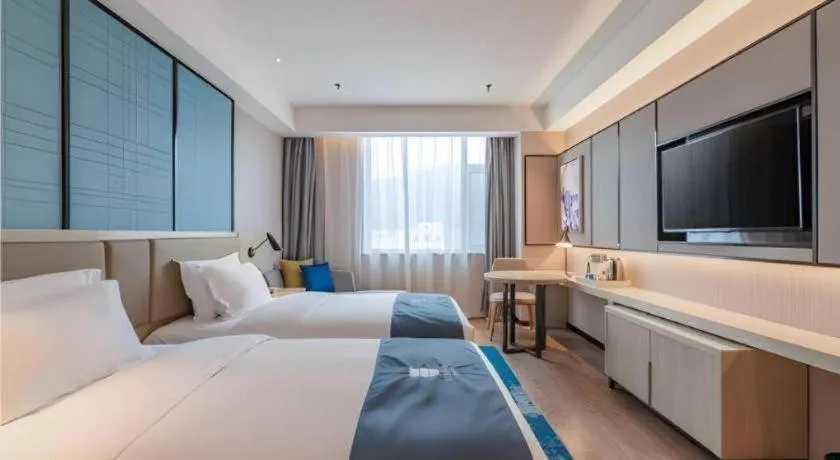 Bed in Echarm Hotel Tai'an Taishan Tianwai Village Hongmen