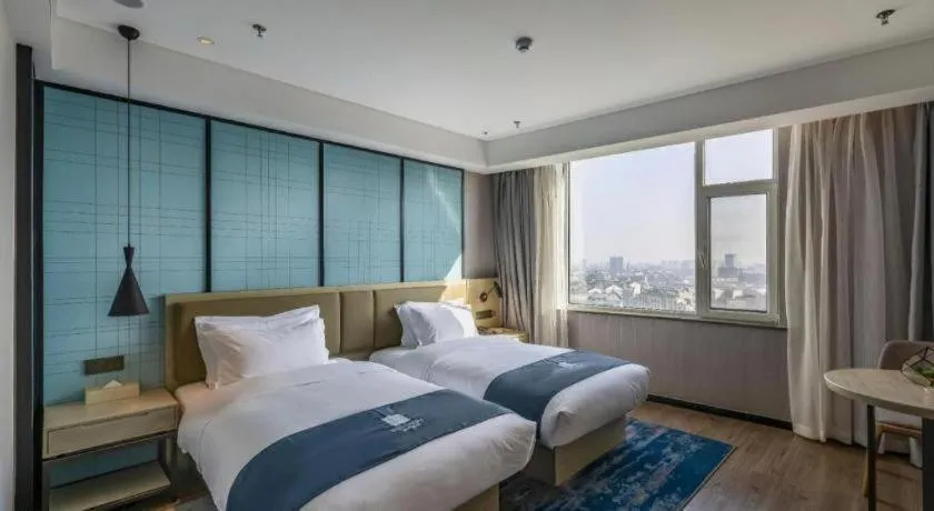 Bed in Echarm Hotel Tai'an Taishan Tianwai Village Hongmen