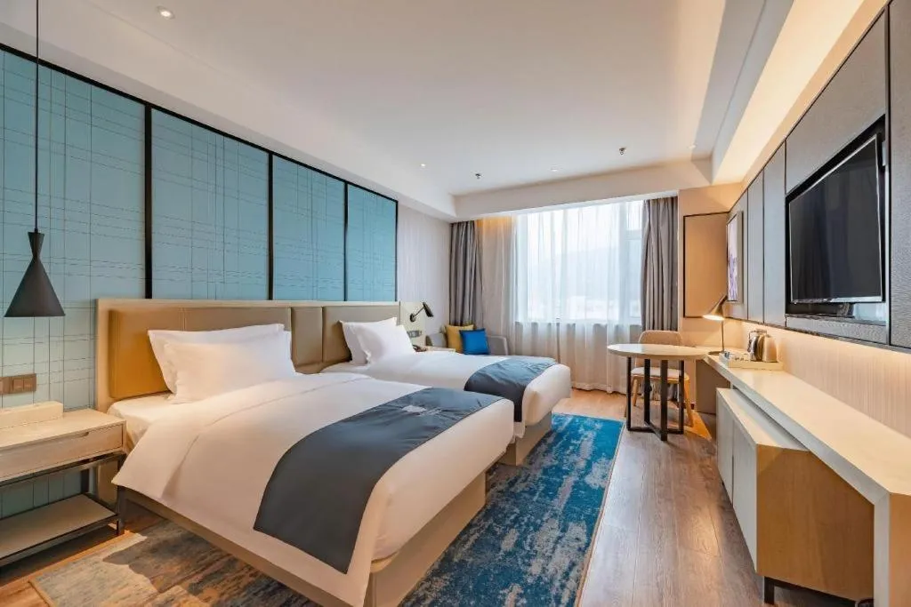 Bed in Echarm Hotel Tai'an Taishan Tianwai Village Hongmen