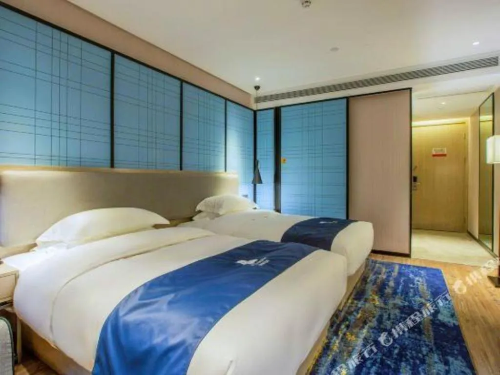 Bed in Echarm Hotel Nanning Dongge Macun Metro Station