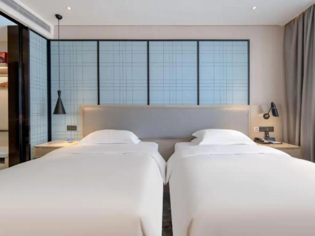 Bed in Echarm Hotel Nanning Dongge Macun Metro Station