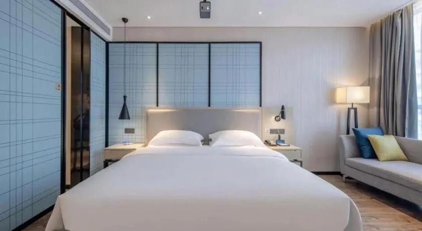 Bed in Echarm Hotel Nanning Dongge Macun Metro Station