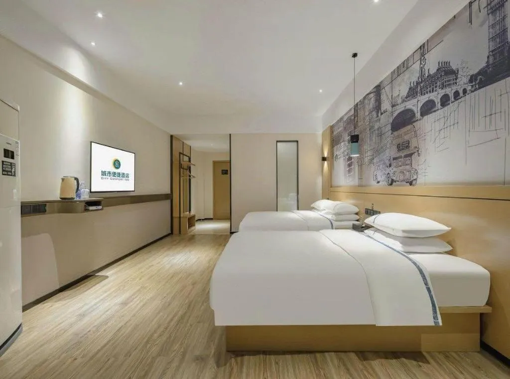 Bed in City Comfort Inn Wuzhou High-speed Railway Station Canghai Lake Park