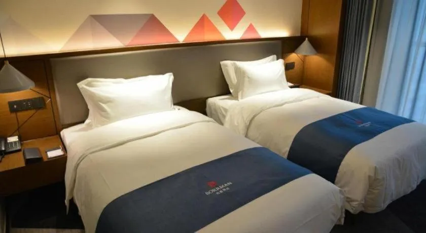 Bed in Borrman Hotel Ji'nan Aoti Center East Provincial Hospital