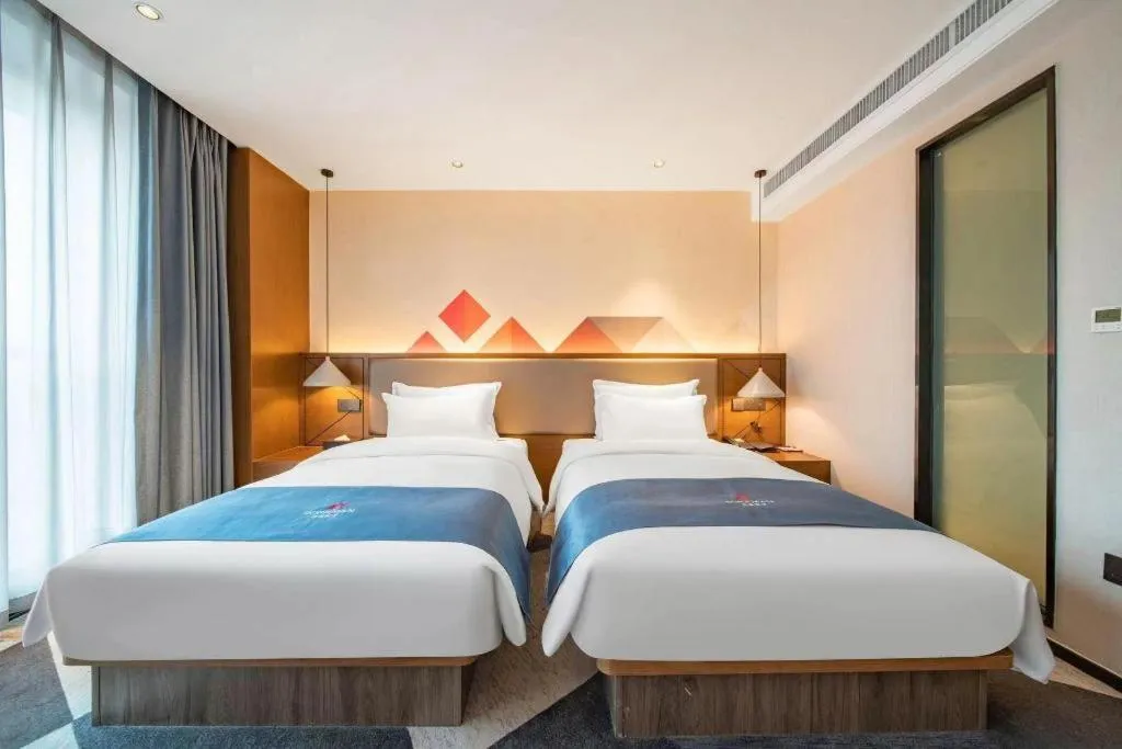 Bed in Borrman Hotel Ji'nan Aoti Center East Provincial Hospital