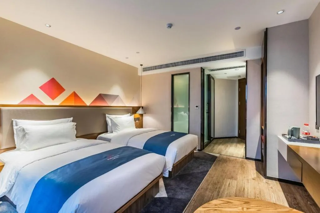 Bed in Borrman Hotel Ji'nan Aoti Center East Provincial Hospital