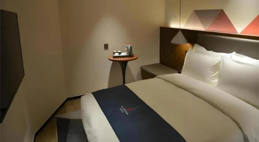 Bed in Borrman Hotel Ji'nan Aoti Center East Provincial Hospital