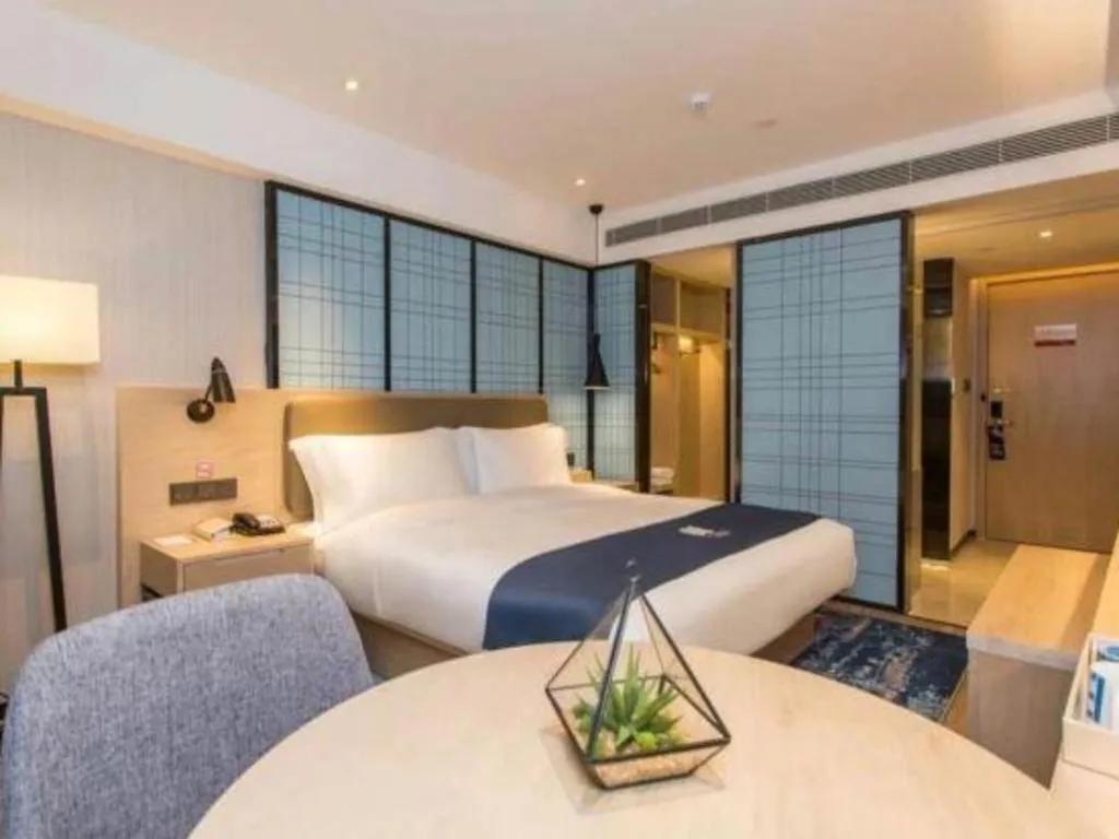 Bed in Echarm Hotel Kunming High-speed Railway South Station Chunrong Street Metro Station