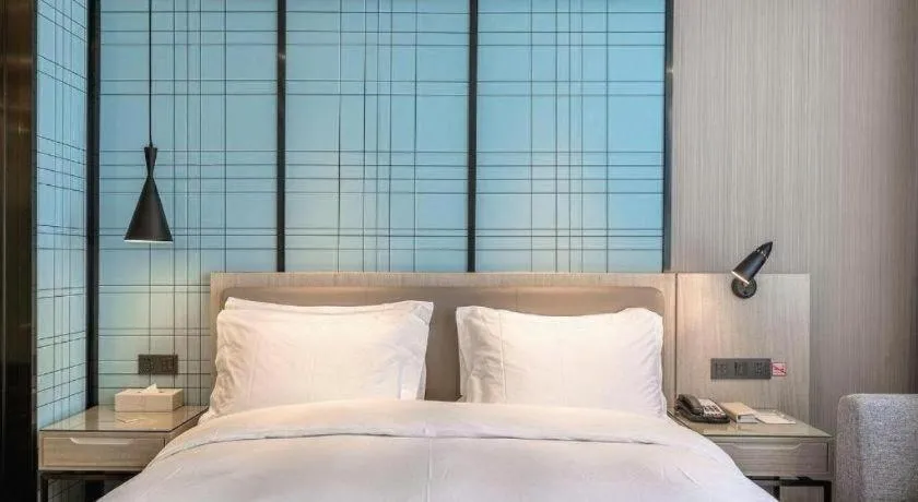 Bed in Echarm Hotel Kunming High-speed Railway South Station Chunrong Street Metro Station