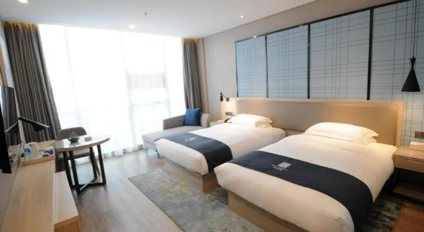 Bed in Echarm Hotel Kunming High-speed Railway South Station Chunrong Street Metro Station