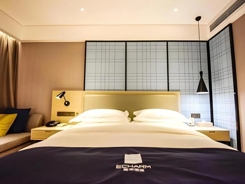 Bed in Echarm Hotel Kunming High-speed Railway South Station Chunrong Street Metro Station