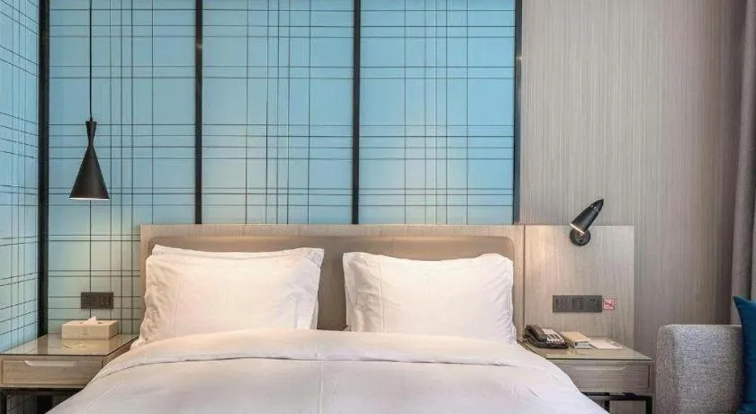 Bed in Echarm Hotel Kunming High-speed Railway South Station Chunrong Street Metro Station